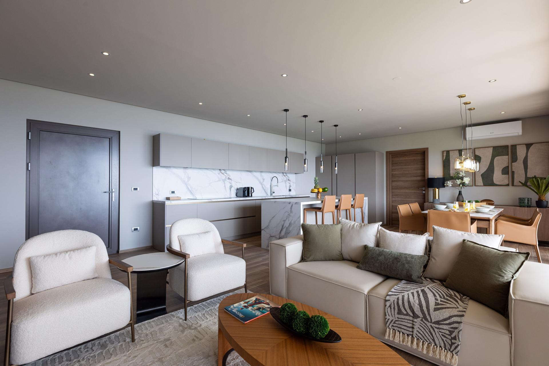 Contemporary Ocean‑View Apartment with Marble‑Veined Waterfall Island & Panoramic Glass Terrace