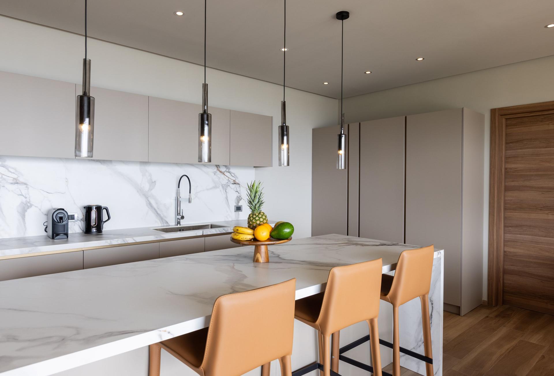 Contemporary Ocean‑View Apartment with Marble‑Veined Waterfall Island & Panoramic Glass Terrace