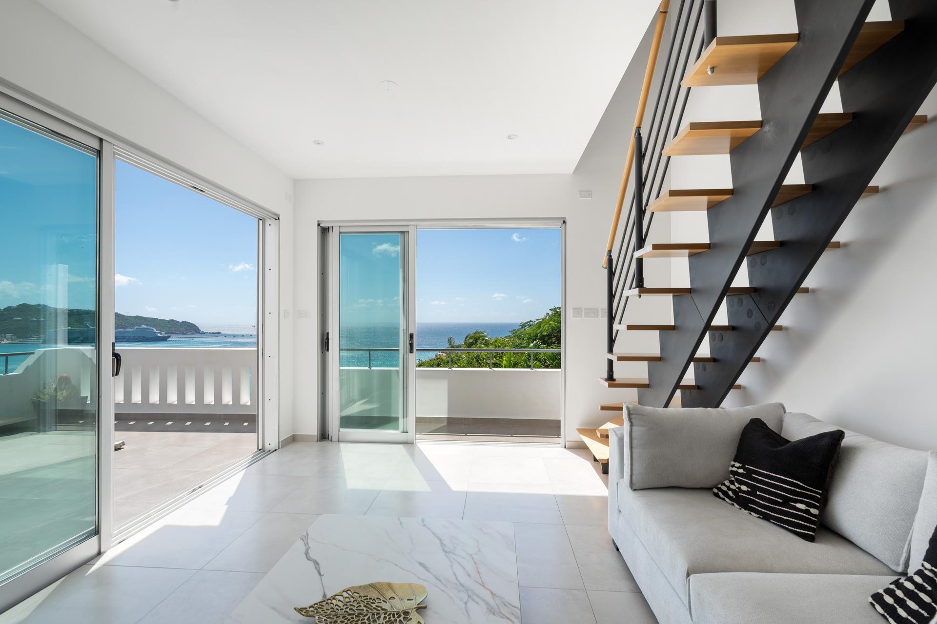 Contemporary Coastal Penthouse with Panoramic Ocean Vistas & Floating Oak Staircase