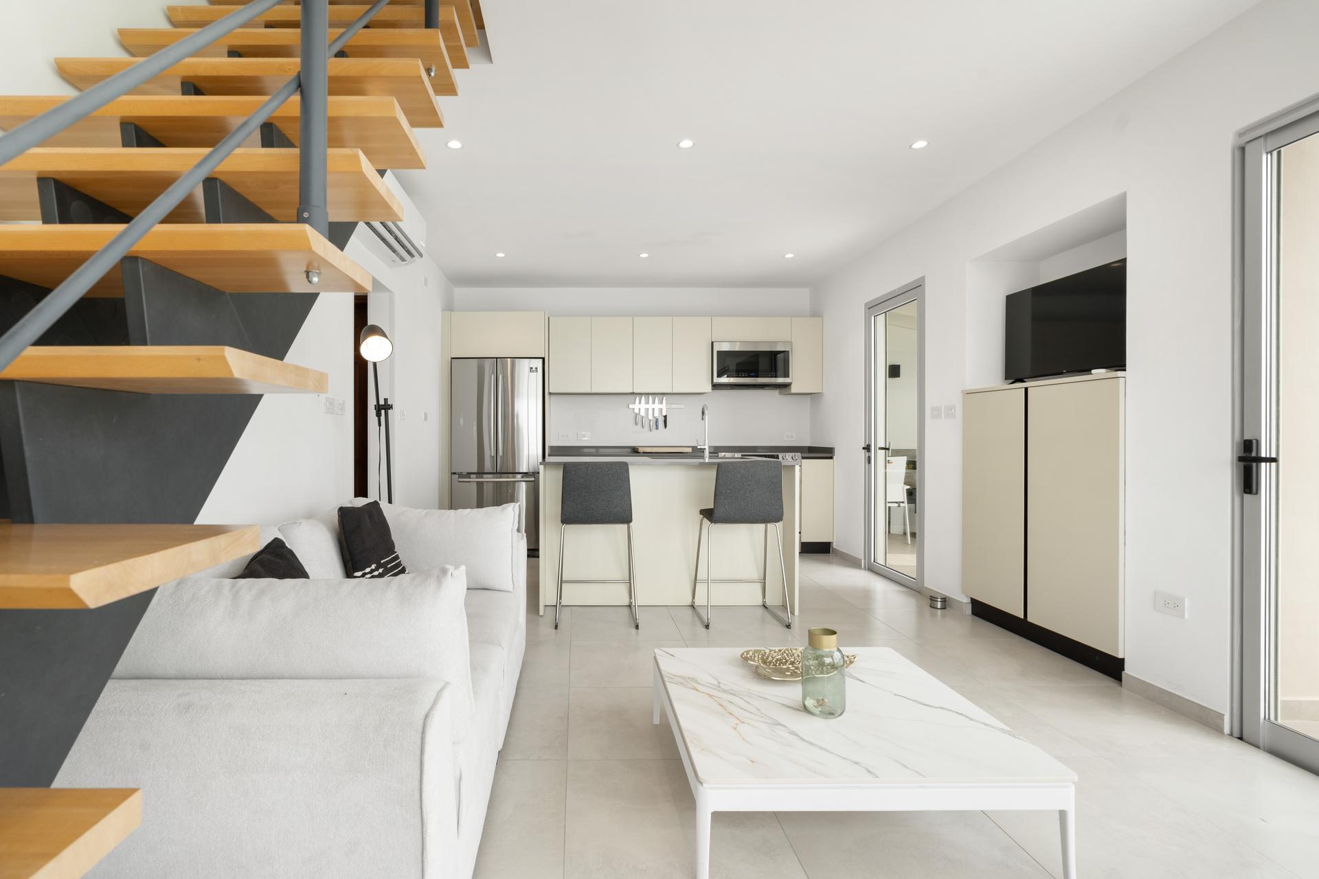 Contemporary Coastal Penthouse with Panoramic Ocean Vistas & Floating Oak Staircase